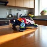 Small Talavera Sea Turtle Planter | Hand-Painted Mexican Turtle Pottery - hand-painted Talavera turtle planter with floral design on wooden kitchen counter
