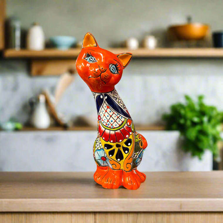 Talavera Curious Cat Statue | Handcrafted Mexican Folk Art Cat Figurine - hand-painted orange Talavera cat statue with colorful floral pattern