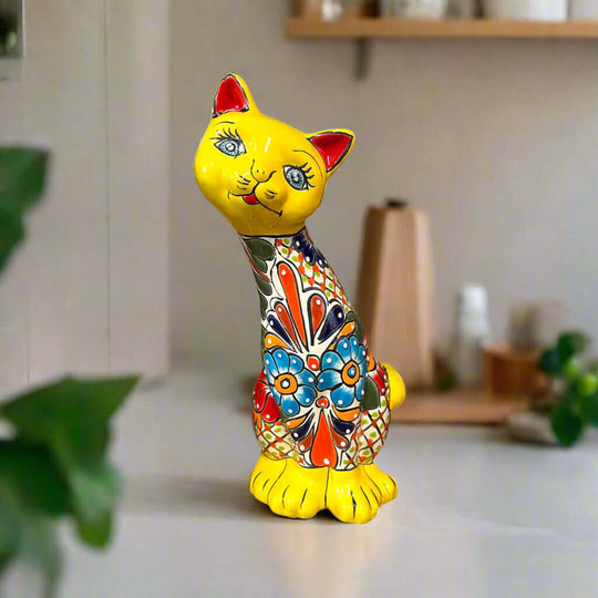 Talavera Curious Cat Statue | Handcrafted Mexican Folk Art Cat Figurine - hand-painted yellow Talavera cat figurine with colorful floral design