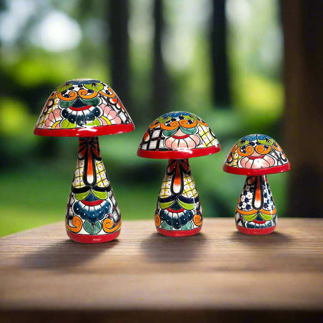 Talavera Mushroom Statue Set | Hand-Painted Mexican Garden Decor - three colorful hand-painted Talavera mushroom statues on wooden table