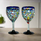 Hand Blown Mexican Wine Glasses | Blue Rim Confetti Design - pair of hand-blown, lead-free glasses with cobalt blue rim and colorful confetti pattern