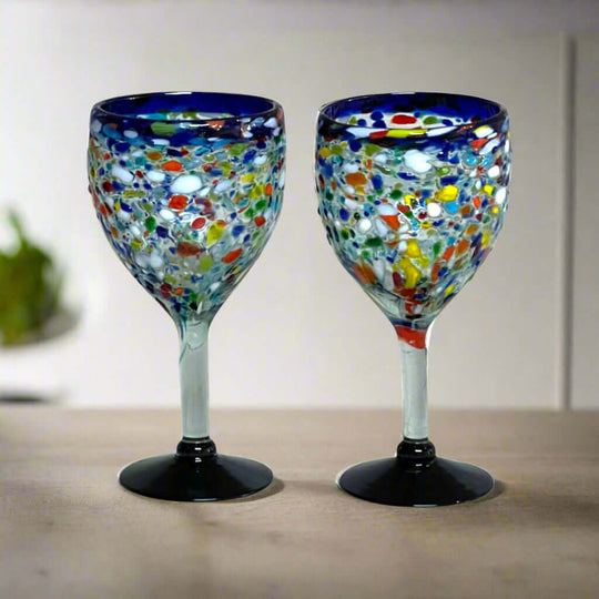 Hand Blown Mexican Wine Glasses | Blue Rim Confetti Design - pair of hand-blown, lead-free glasses with cobalt blue rim and colorful confetti pattern