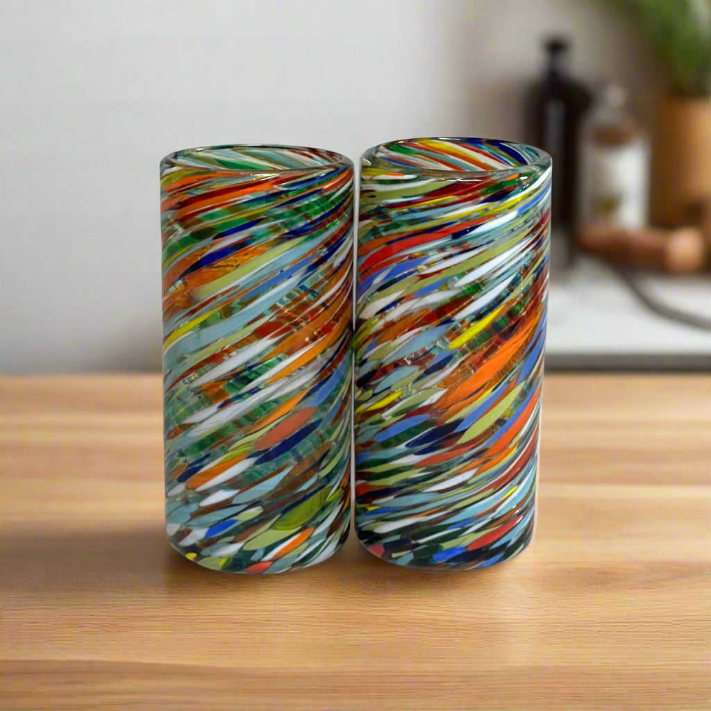 Two colorful cylindrical glass vases on a white background
