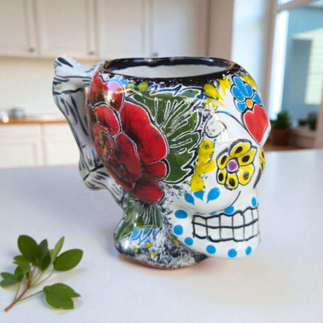 Colorful Talavera Skull Mug | Handcrafted Ceramic Coffee Cup - hand-painted skull mug with red floral motif, butterfly accent, green red yellow tones