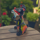 Talavera Dog Holding Newspaper Statue | Colorful Mexican Garden Art - hand-painted red dog holding newspaper, bright floral Talavera design