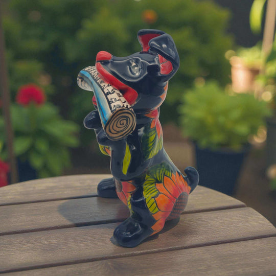 Talavera Dog Holding Newspaper Statue | Colorful Mexican Garden Art - hand-painted red dog holding newspaper, bright floral Talavera design