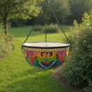 The Talavera Hub hand-painted ceramic hanging planter with blue rim, floral & geometric motifs. 10" wide.