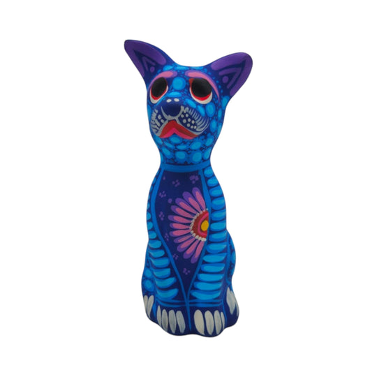 Alebrije Sitting Dog Statue | Hand-Painted Decorative Art in vibrant blue and purple with floral designs.