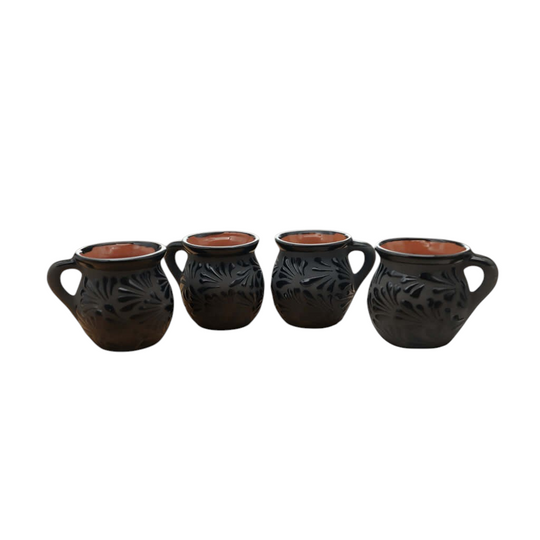Black Talavera Jarrito Mug | Handmade Mexican Clay Coffee Cup set on kitchen table.