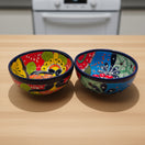 5" Colorful Talavera Bowl | Handcrafted Mexican Folk Dish showing two vibrant hand-painted bowls with bold floral motifs and cobalt rims