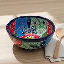 5" Colorful Talavera Bowl | Handcrafted Mexican Folk Dish hand-painted floral Talavera bowl with cobalt rim on wooden table