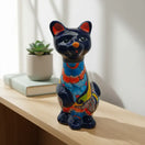 Talavera Cat Statue | Hand-Painted Mexican Ceramic Figurine — glossy dark blue floral Mexican ceramic cat on shelf