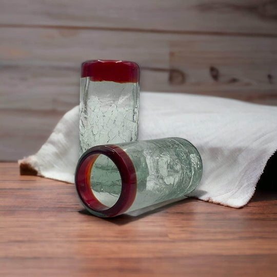 Hand-Blown Crackled Shot Glass | Red Rim Mexican Barware - pair of hand-blown crackled shot glasses with vibrant red rims on wooden table