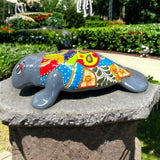 Mexican Handmade Seal Statue | Colorful Talavera Seal (Medium Size) colorful hand-painted talavera seal statue on stone pedestal outdoors