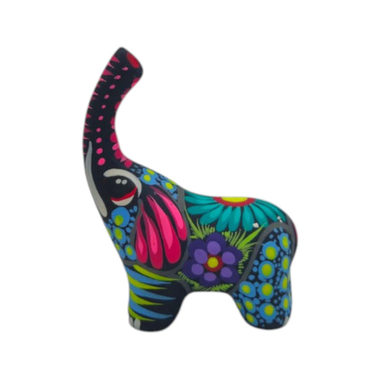 Side view of hand-painted ceramic Alebrije elephant with blue, pink, and floral details