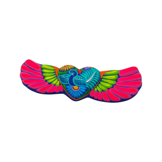 Colorful ceramic Alebrije heart wall art with pink wings and floral details