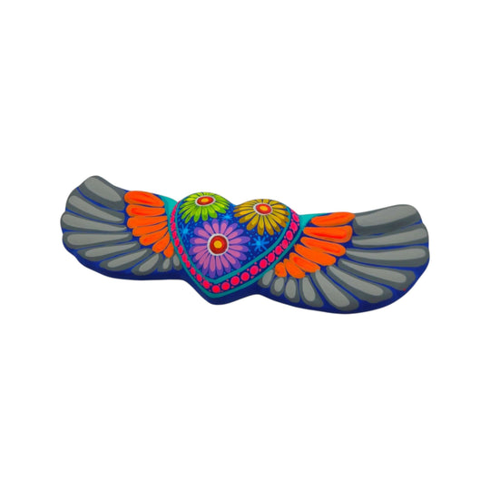 Detailed view of handmade ceramic heart wall art with gray wings and floral patterns