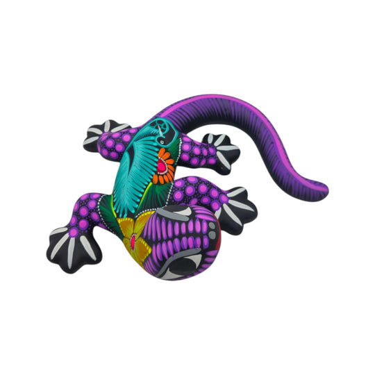 Purple and multicolor ceramic Alebrije lizard figurine on a white background
