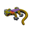 Yellow and multicolor ceramic Alebrije lizard figurine shown from a side angle