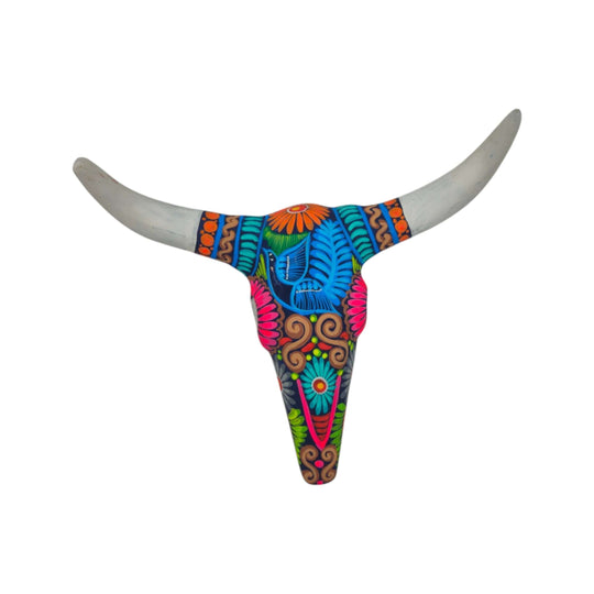 Angled view of colorful bull skull wall art showing patterned center and pale horns