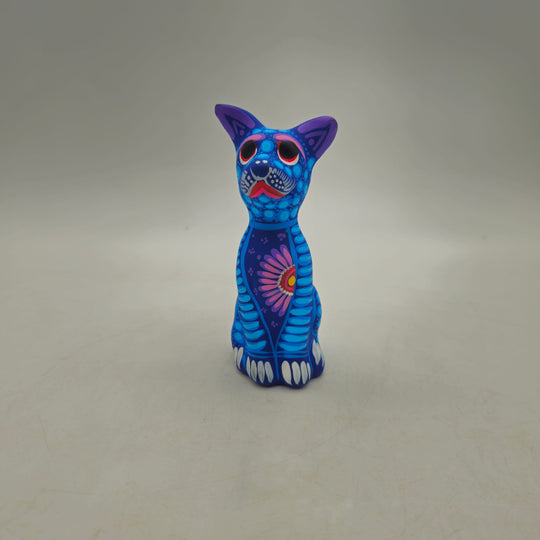 Alebrije Sitting Dog Statue — TGH-6763; actual product against its original background.