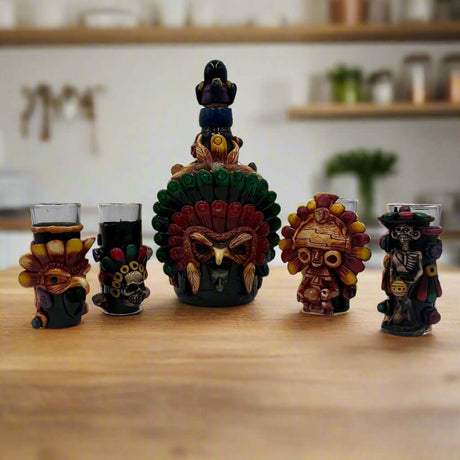 Mexican Shot Glass Set | Artisan Aztec Warrior Decanter Kit handcrafted Aztec warrior decanter and five colorful shot glasses on wooden table