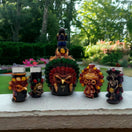 Mexican Shot Glass Set | Artisan Aztec Warrior Decanter Kit handcrafted colorful Aztec warrior decanter with matching shot glasses on outdoor ledge