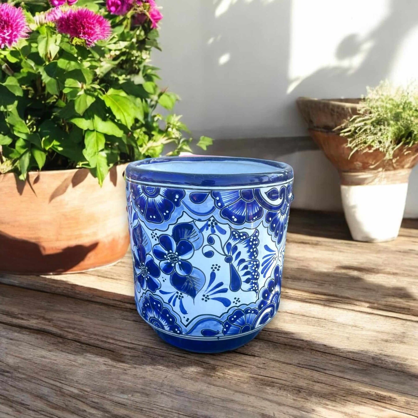 Artisan Talavera Planter | Blue & White Mexican Flower Pot hand-painted blue and white Talavera ceramic on wooden patio