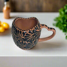 Black Talavera Heart Mug – Slightly Imperfect & Handmade hand-painted black and clay heart-shaped mug with decorative floral pattern