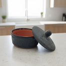 Black Talavera Tortilla Keeper | Handcrafted Ceramic Warmer on kitchen counter, matte black carved floral design, hand-painted lead-free glaze