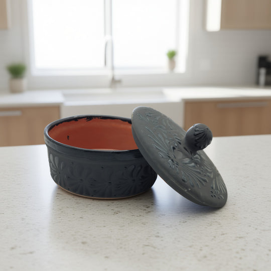 Black Talavera Tortilla Keeper | Handcrafted Ceramic Warmer on kitchen counter, matte black carved floral design, hand-painted lead-free glaze
