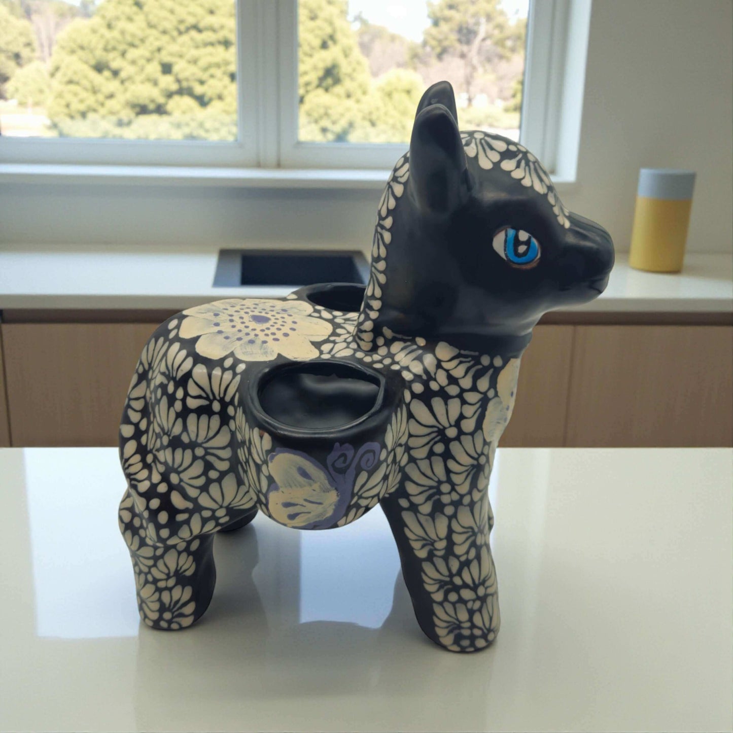 Floral Black & White Talavera Donkey Planter | Mexican Pottery hand-painted glossy black-and-white floral donkey planter with bright blue eyes