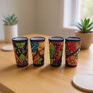 Blue Rim Talavera Shot Glass | Hand-Painted Mexican Drinkware - set of four colorful hand-painted tall shot glasses with bold blue rims