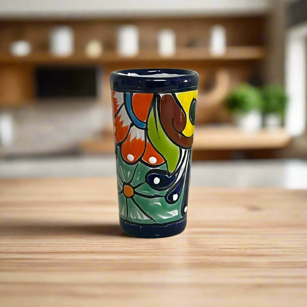 Blue Rim Talavera Shot Glass | Hand-Painted Mexican Drinkware hand-painted tall Talavera shot glass with bold blue rim and colorful floral motifs