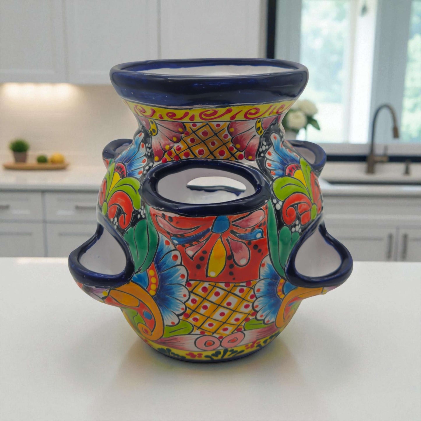 Blue Rim Talavera Strawberry Pot | Hand-Painted Mexican Planter on kitchen counter, vibrant hand-painted floral design with deep blue rim