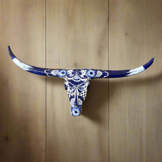 Talavera Longhorn Skull | Blue & White Mexican Wall Art - hand-painted Talavera longhorn skull with blue floral motifs on wood background