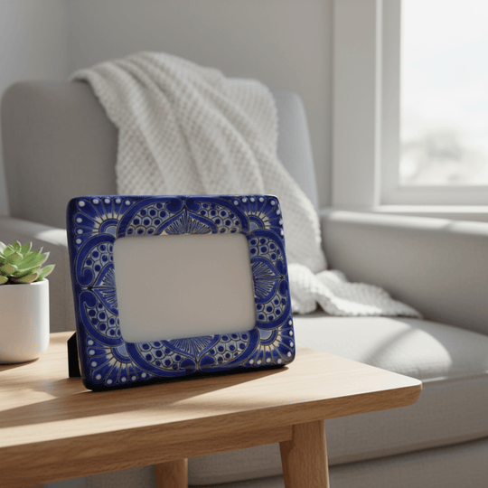 Blue and white Talavera picture frame displayed on a table in a living room