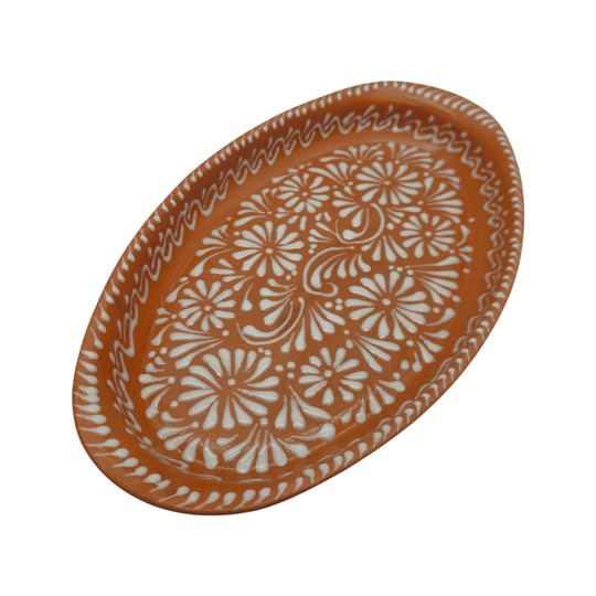 Brown and white Talavera oval platter shown from the front with floral hand-painted details