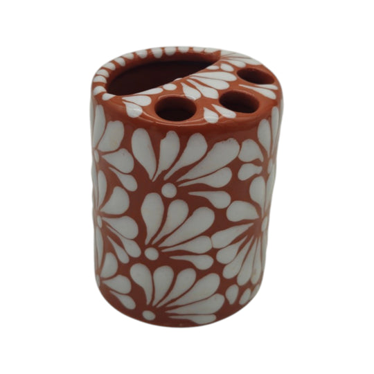 Top view of brown and white Talavera toothbrush holder showing toothbrush openings