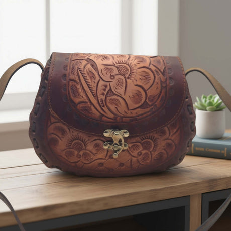 Cincelada Floral Leather Crossbody | Hand Tooled Saddle Purse on table