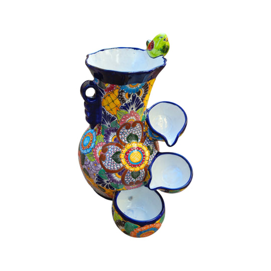 Colorful Talavera ceramic fountain with bird accent shown against a white background