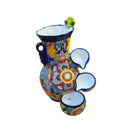 Angled view of colorful Talavera ceramic fountain with blue edging and floral basins