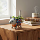 The Talavera Hub colorful ceramic cat planter with hand-painted floral motifs and succulents. Multicolor.