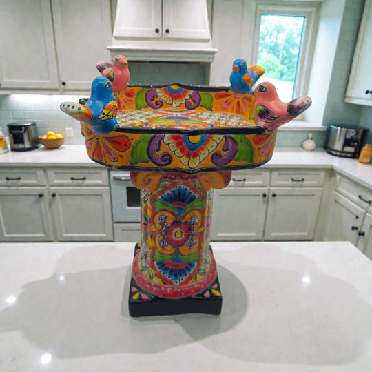 Colorful Talavera Bird Bath | Hand-Painted Ceramic Garden Art on kitchen island, hand-painted floral motifs and perched ceramic birds