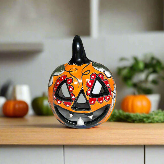 Talavera Jack-O'-Lantern | Colorful Mexican Pumpkin Decor hand-painted orange floral ceramic pumpkin with jack-o'-lantern face