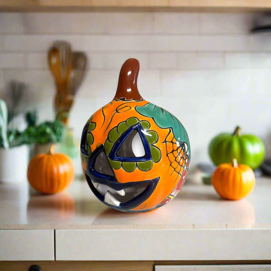 Talavera Jack-O'-Lantern | Colorful Mexican Pumpkin Decor hand-painted Talavera ceramic pumpkin with floral motifs on kitchen counter