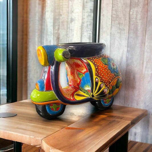Colorful Talavera Scooter Planter | Hand-Painted Ceramic Scooter Statue (Large) vibrant hand-painted Talavera scooter planter with floral motifs on wood table