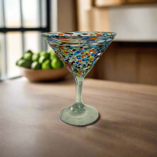Confetti Pebbled Martini Glass | Hand-Blown Mexican Barware on wooden table, colorful hand-blown pebble pattern and classic martini silhouette