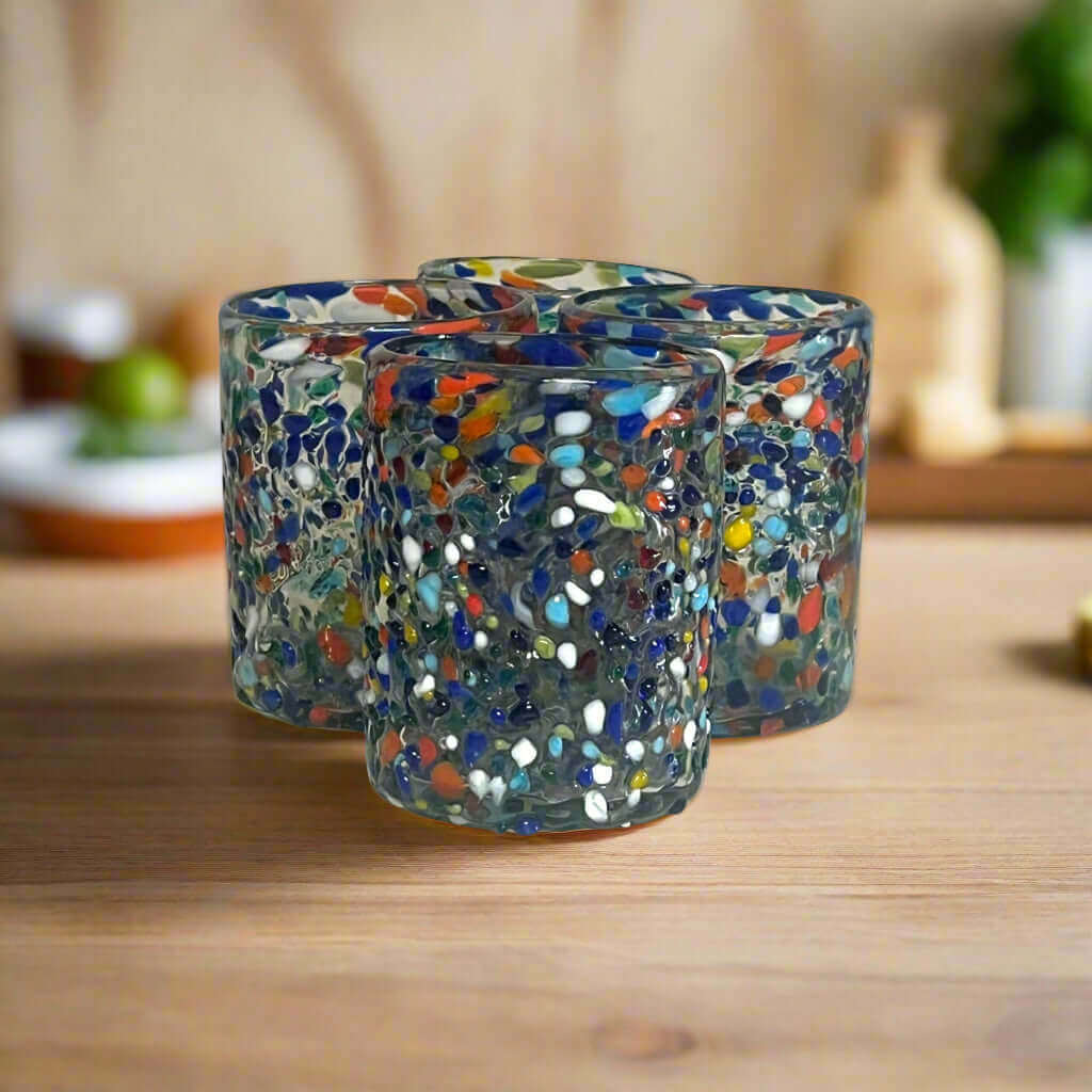Confetti Pebbled Tumbler | Hand-Blown Mexican Glassware — hand-blown lead-free glass tumbler with blue, orange, green and white confetti pebbles