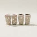 Cream Talavera Shot Glass | Handcrafted Mexican Ceramic, set of four cream-toned hand-painted Talavera shot glasses with white floral relief patterns, kiln-fired